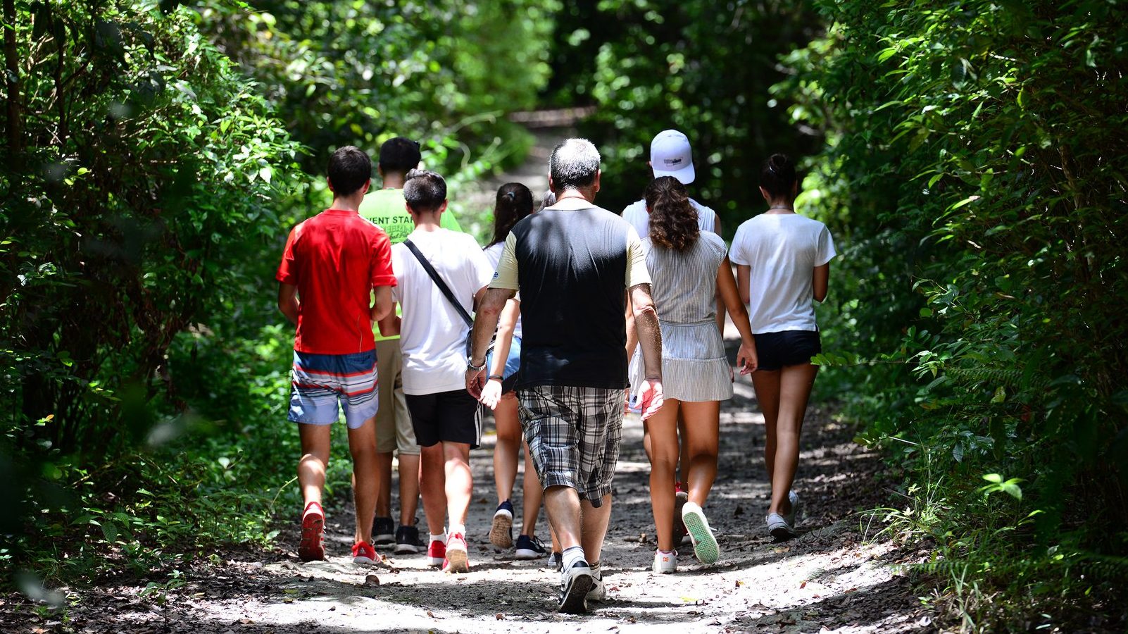 Small group walking through the nature preserve during Deering's Natural Areas tour