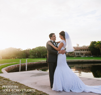 A couple conducting a bridal photoshoot by the boat basin