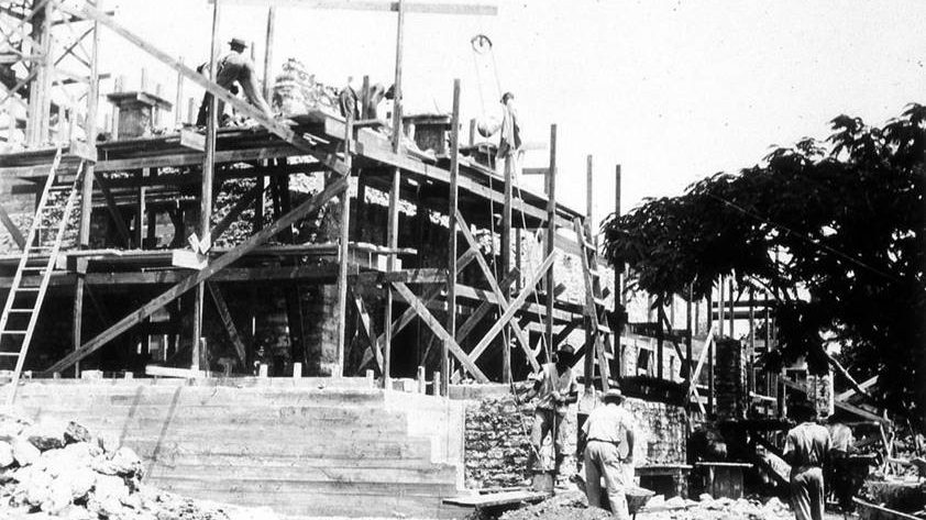 Builders working diligently on Charles Deering's Stone House in 1922