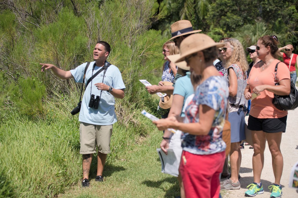 Wildlife expert Rangel Diaz leading his tour group through Deering Estate during a hike.
