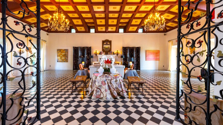 Opulent ballroom with checkered marble floors at Deering Estate