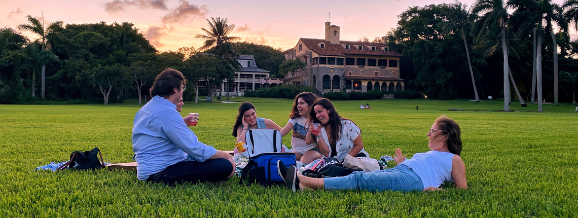family enjoying an outdoor picnic at Deering Estate in Miami