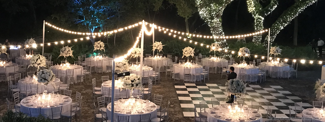 photo of a reception at Deering Estate’s historic Courtyard. The couple is admiring their reception area during this reception-reveal.