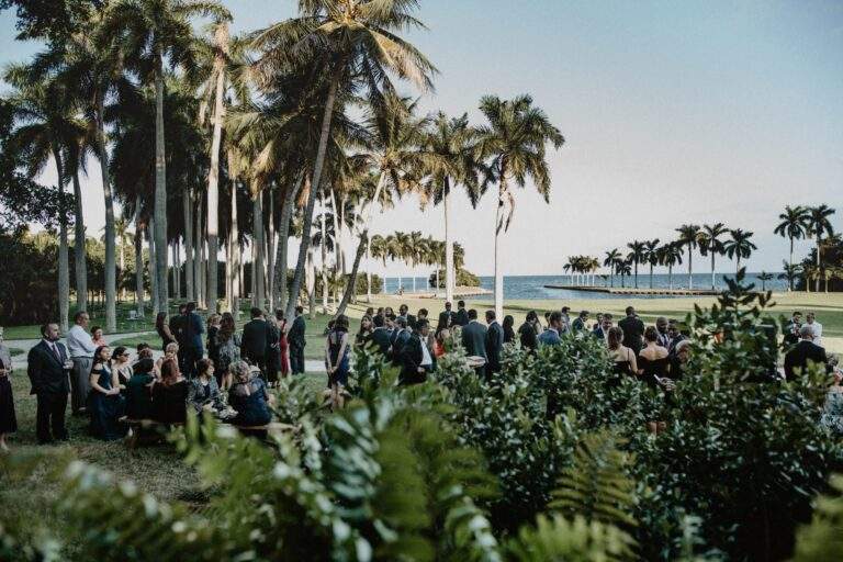 Wedding guests stand in front of the Richmond Cottage.