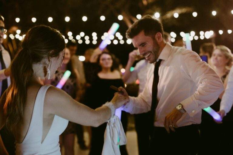A bride and groom dancing together at their wedding reception.