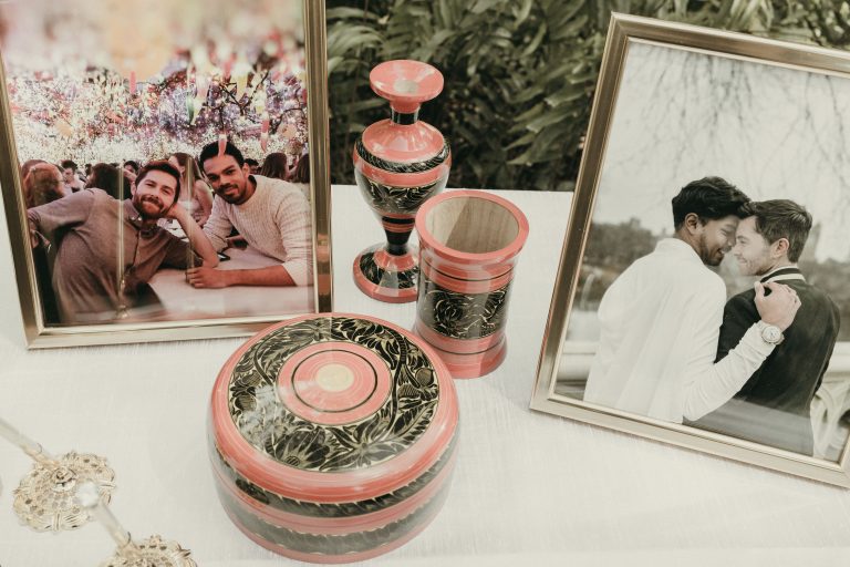 A wedding's welcome table for guests, featuring the grooms pictures