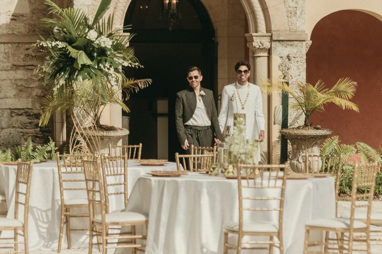 Grooms entering the reception site hand-in-hand before the wedding begins