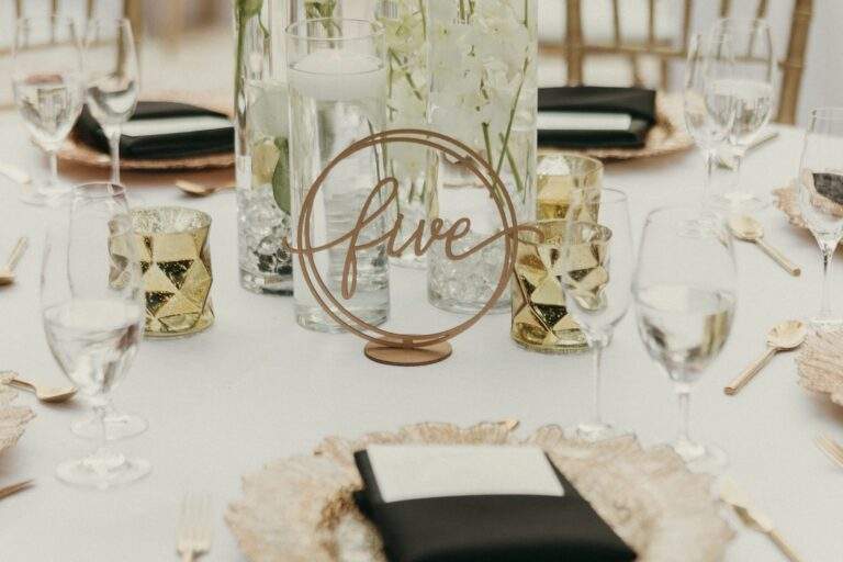 Detail shot of a table with gold and black details and place settings