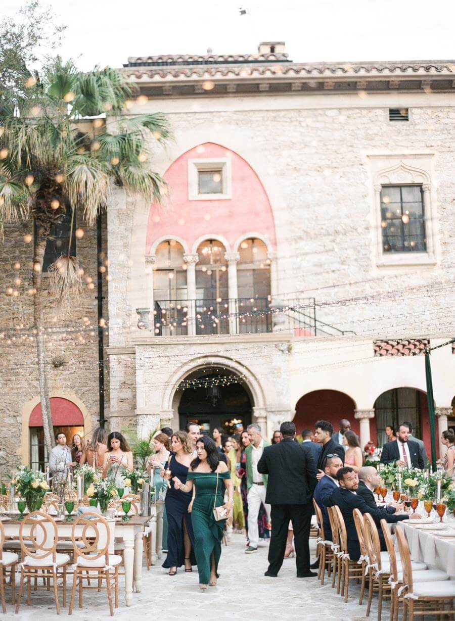 Wedding guests entering the reception for the first time at Deering Estate's Courtyard