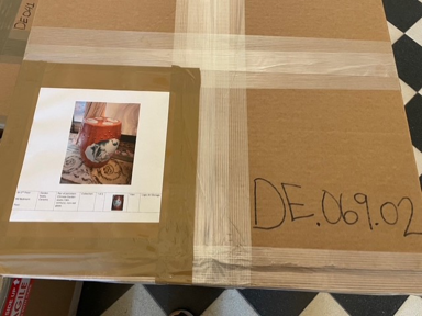 A Stone House collection piece in a sealed cardboard box with a catalog number on the outside of it.