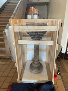 Custom-made crate that was built to hold a collection piece (a cement planter) for the Stone House Restoration Project.