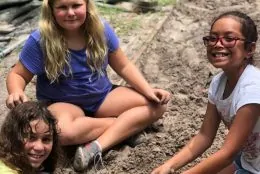 Social studies field trip with kids learning about archaeology exploration.